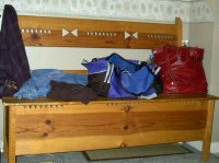 wooden bench with stuff on it